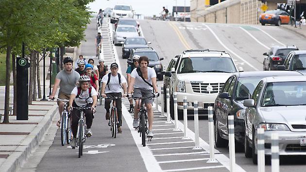 Bollards separate bike lanes from cars (Image Credit: BikeSD)