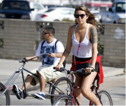 Woman biking in downtown San Diego